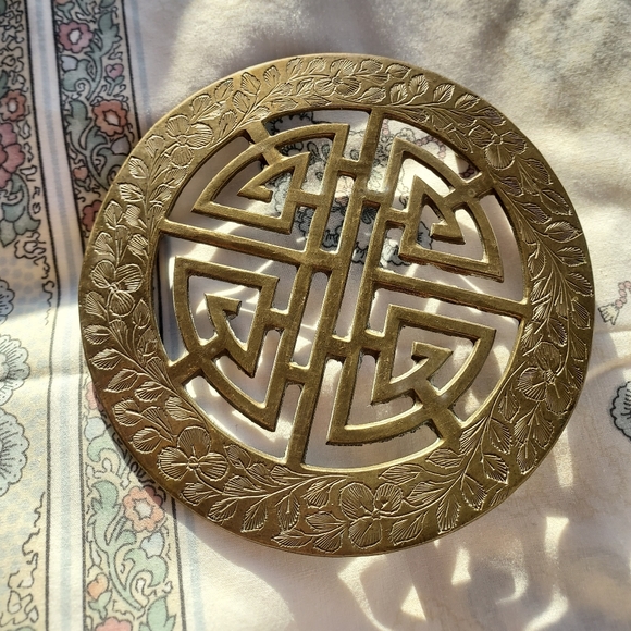 Vintage antique brass floral etched trivet.